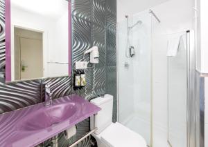 a bathroom with a purple sink and a shower at Nest Style Granada in Granada +64 photos