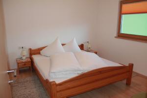 Ένα ή περισσότερα κρεβάτια σε δωμάτιο στο Haus Sennhof