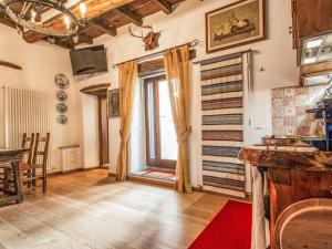a living room with a window and a table at Apartment Maghinardo by Interhome in Palazzuolo sul Senio +4 photos