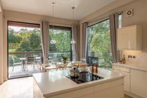 a kitchen with a large window and a table with chairs at Finley in Richmond