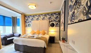 a hotel room with a bed and a couch at Yardley Manor Hotel in Torquay