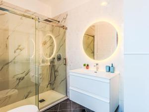a bathroom with a shower and a sink at Apartment Casa Luvit by Interhome in Menaggio