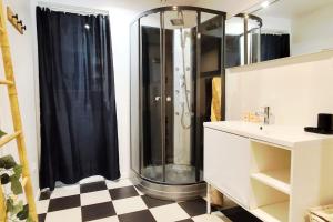 a bathroom with a shower and a sink at Modern in Bègles