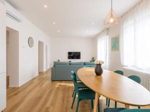 a living room with a table and a couch at Apartment Lago di Luce by Interhome in Riva del Garda