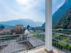 a balcony with a view of a city and mountains at Apartment Lago di Luce by Interhome in Riva del Garda