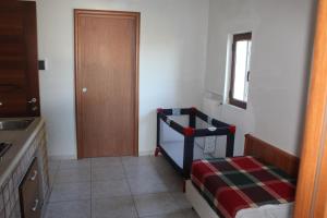 a small room with a bed and a window at Residence Hotel Torresilvana in Vieste