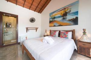 Un pat sau paturi într-o cameră la Recanto Praiana de Búzios