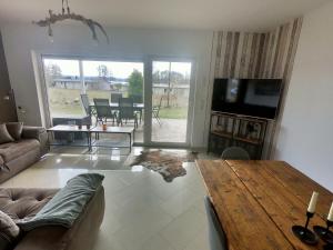 a living room with a couch and a table at Seeluft in Warin