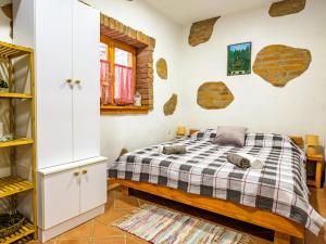 a bedroom with a bed in a room at Chalet Pine Hill by Interhome in Klenovnik