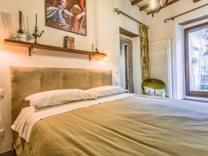 a bedroom with a large bed in a room at Apartment Cia by Interhome in Palazzuolo sul Senio +3 photos