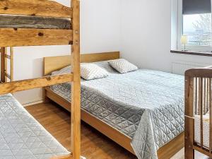 a bedroom with two bunk beds and a window at Apartment Stadsro by Interhome in Vimmerby
