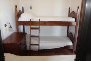 two bunk beds in a room with a desk at Residence Hotel Torresilvana in Vieste