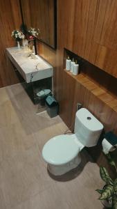 a bathroom with a toilet and a sink at Angghy Garden Tetebatu in Tetebatu +27 photos