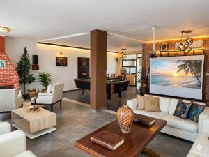 a living room with a pool table at Villa Mabrouka in Raʼs al Jabal