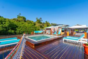 a pool on the deck of a house at Coral Wing Casitas in Bastimentos