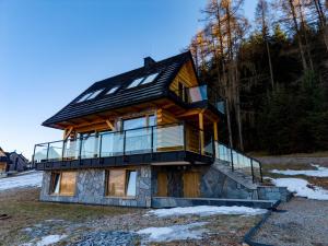 a house with a roof on top of it at Ostoja Urnica in Falsztyn