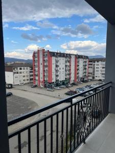 a balcony with a view of a parking lot at Stan na dan Stanojević in Bratunac
