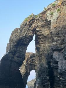 an arch in the side of a mountain at Casal de pelaio in Barreiros +253 photos