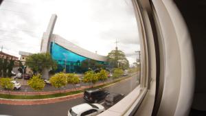 a view from a window of a street and a building at Sir Hotel in Telêmaco Borba