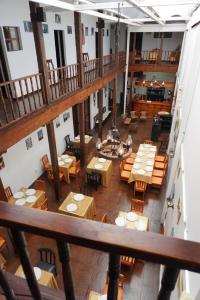 an overhead view of a restaurant with tables and chairs at Mansión del Parque by CS in Guaranda