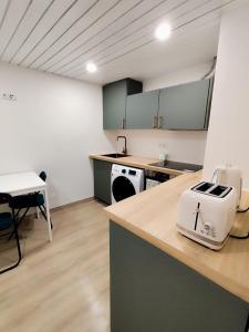a kitchen with a counter with a toaster on it at Cantinho do Corgo in Vila Real