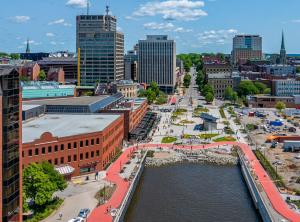 an aerial view of a city with a river and buildings at Saint John Harbourfront Hotel in Saint John