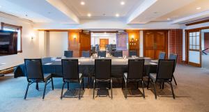 a conference room with a large table and chairs at Saint John Harbourfront Hotel in Saint John +39 photos