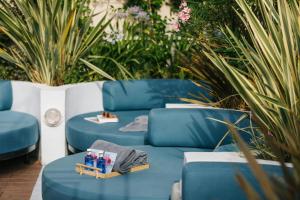 a group of blue chairs with drinks on them at The Social Hub Madrid 4 star in Madrid