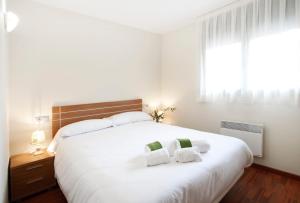 Postel nebo postele na pokoji v ubytování Andorra4days Soldeu - El Tarter
