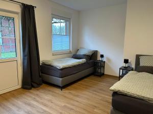 a living room with a couch and a window at Landidyll Georg in Ostbevern
