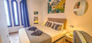 a bedroom with two beds with towels on them at Adeje Paradise dreams in Playa Paraiso +44 photos