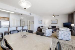 a living room with a table and chairs at TOPS'L Tides II in Destin