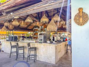 a bar in a restaurant with chairs and a counter at Adeje Paradise dreams in Playa Paraiso