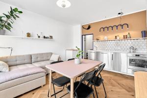 a living room with a couch and a table at O'Hara in Horní Blatná