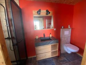 a bathroom with a sink and a toilet and a mirror at Chambre Ephédra in Sampzon +12 photos