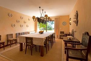 a dining room with a large table and chairs at GuestReady - Tranquillity in Baião in Baião