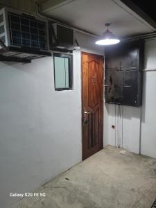 an empty room with a door and a room with a room at Knights-Apple Inn in Mambajao +28 photos