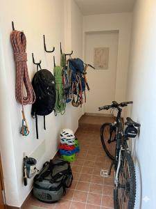 a room with a bike parked in a room at GUEST ROOM GRADONOVE in Arco +1 photo