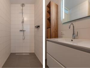 a bathroom with a shower and a sink at Het Havenverblijf in Kamperland +25 photos
