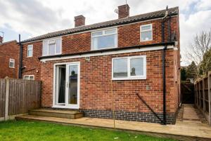 a brick house with white windows at Contemporary Private Home Near Nottingham with Free Parking and Garden in Sandiacre +7 photos