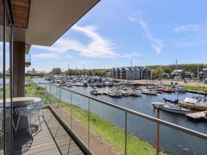a balcony with a view of a marina at Marina Vista in Kamperland