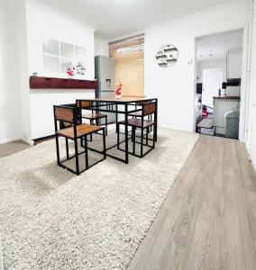 a kitchen and dining room with a table and chairs at Reading Central Haven in Reading