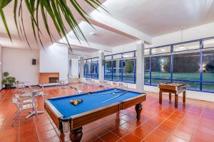 a large room with a pool table in it at HI Ovar - Pousada de Juventude in Ovar