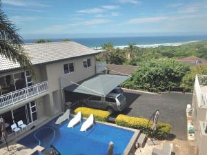 an aerial view of a house with a pool and the ocean at Miskin Place Unit 2 in Kelso