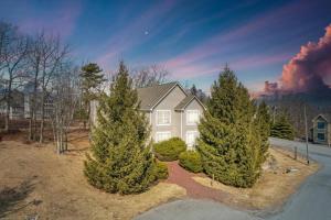 a house with pine trees in front of it at A Blind Camelback Mtn views 2m to slopes in Tannersville