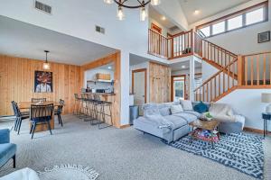 a living room with a couch and a table at A Blind Camelback Mtn views 2m to slopes in Tannersville