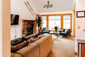a living room with a couch and a fireplace at A Blind Camelback Mtn views 2m to slopes in Tannersville