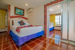 a bedroom with a bed in a room at Hotel Sol Caribe in Isla Mujeres