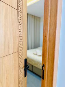 an open door to a bedroom with a bed at SOHO Rooftop 360 Sunset Edition in Essaouira