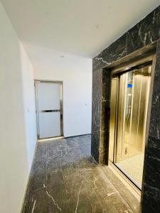 a hallway with a glass door in a room at SOHO Rooftop 360 Sunset Edition in Essaouira